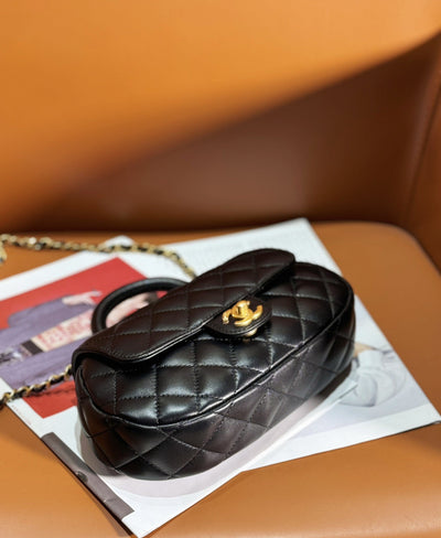 Chan*l 24c top handle flap bag in black lambskin - image 2