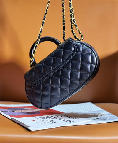 Chan*l 24c top handle flap bag in black lambskin - image 3