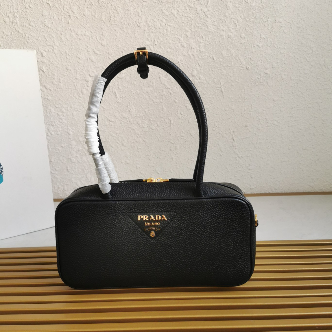 Pr*da medium leather top-handle bag in black - main image