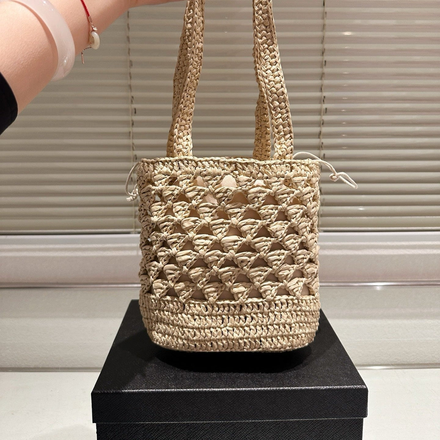 CROCHET BUCKET BAG 18 IN BEIGE WOVEN RAFFIA EMBROIDED LOGO