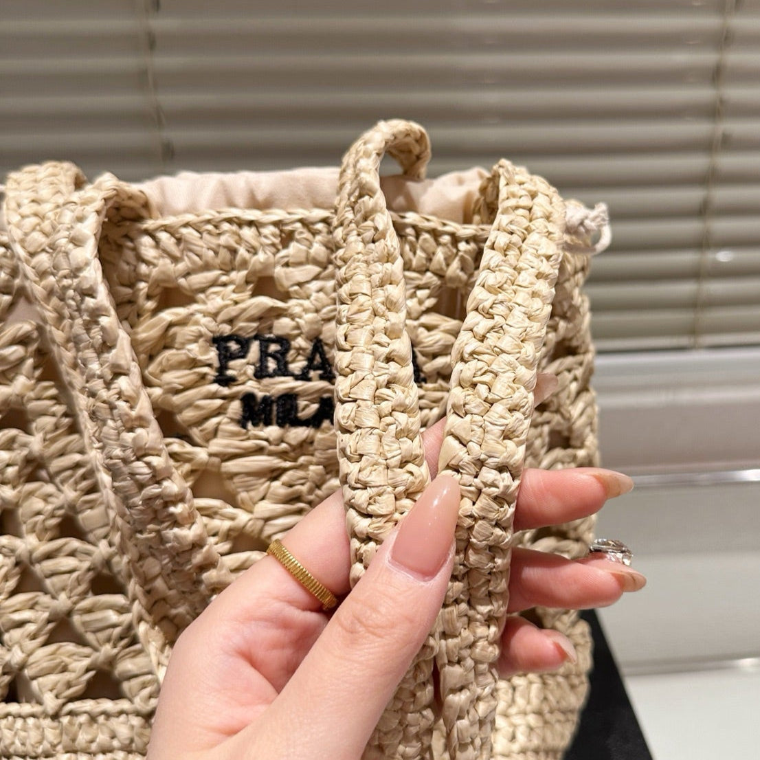 CROCHET BUCKET BAG 18 IN BEIGE WOVEN RAFFIA EMBROIDED LOGO