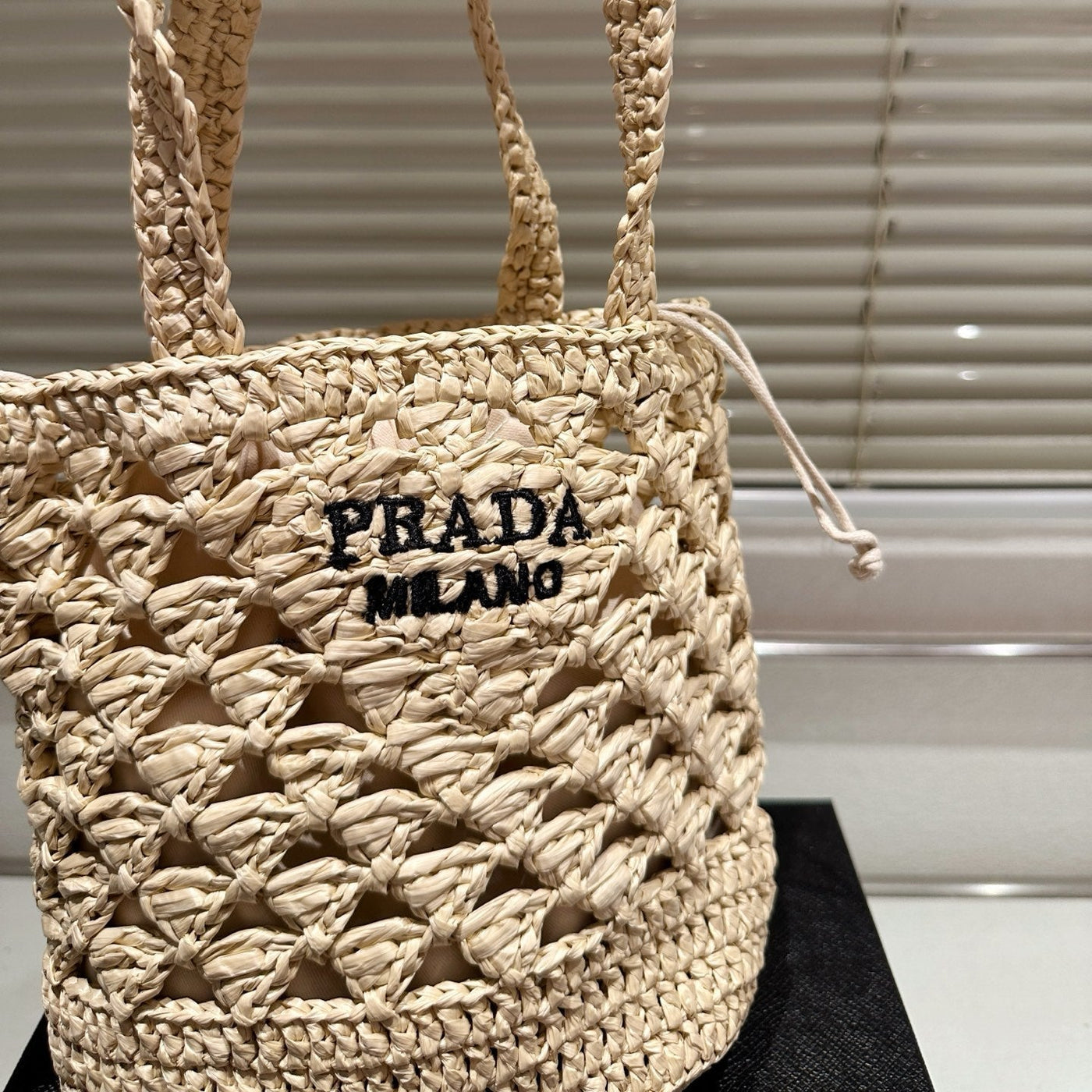 CROCHET BUCKET BAG 18 IN BEIGE WOVEN RAFFIA EMBROIDED LOGO