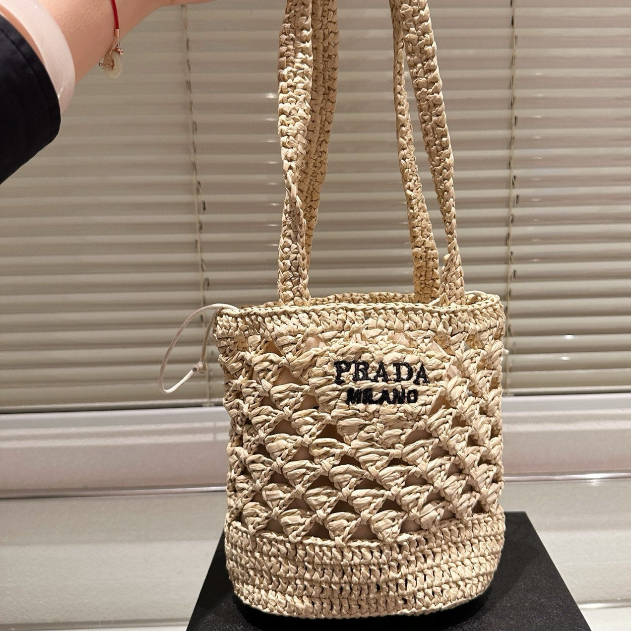 CROCHET BUCKET BAG 18 IN BEIGE WOVEN RAFFIA EMBROIDED LOGO