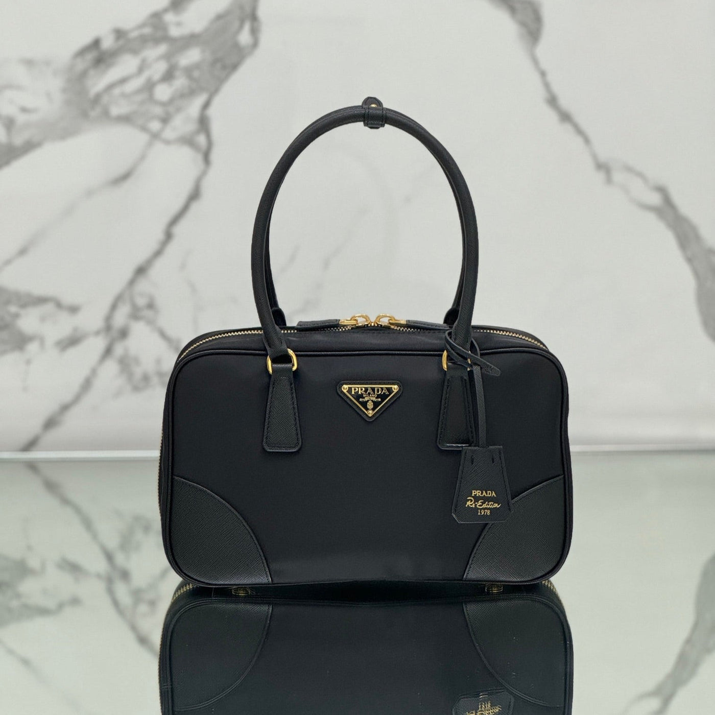 medium top handle bag 30 in black nylon and calfskin trim - main image