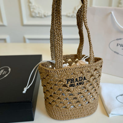 CROCHET BUCKET BAG 32 IN BROWN WOVEN RAFFIA EMBROIDED LOGO